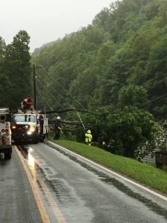 Crews continued restoration work Monday, removing fallen trees that tore down power lines and broke poles in many locations.